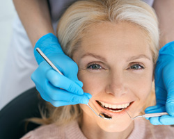 Older woman with a dental bridge in Weyauwega